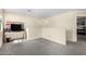 Well-lit living room featuring wall to wall carpet and desk at 2478 W Allens Peak Dr, San Tan Valley, AZ 85144