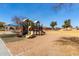 Community playground with slides and swings for hours of fun in a well-maintained park setting at 2478 W Allens Peak Dr, San Tan Valley, AZ 85144