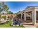 Serene backyard featuring a charming rock pond and comfortable seating at 27044 W Escuda Dr, Buckeye, AZ 85396