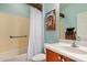 Bathroom with a shower/tub combo, complemented by stylish tile and fixtures at 27044 W Escuda Dr, Buckeye, AZ 85396