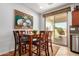 Cozy dining area with a large glass door that opens to the backyard at 27044 W Escuda Dr, Buckeye, AZ 85396