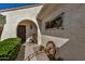 Inviting front entrance with rocking chair, decorative accents and desert landscaping at 27044 W Escuda Dr, Buckeye, AZ 85396