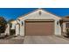 Single Gathering home with two car garage and neutral color palette at 27044 W Escuda Dr, Buckeye, AZ 85396