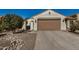 Single Gathering home with two car garage and desert landscaping at 27044 W Escuda Dr, Buckeye, AZ 85396