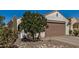 Single Gathering home with two car garage and desert landscaping at 27044 W Escuda Dr, Buckeye, AZ 85396