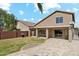 Spacious backyard with grass, bbq, and covered patio, perfect for outdoor entertaining at 2755 E Cowboy Cove Trl, San Tan Valley, AZ 85143