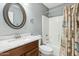 Cozy bathroom featuring a shower-tub combination and a stylish oval mirror at 2755 E Cowboy Cove Trl, San Tan Valley, AZ 85143