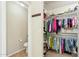 Organized walk-in closet with ample storage and a view to a separate toilet room at 2755 E Cowboy Cove Trl, San Tan Valley, AZ 85143