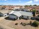 Charming single-story home featuring a low-maintenance desert landscape, a two-car garage and a neutral color scheme at 2801 N Dakota St, Chandler, AZ 85225