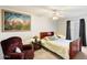 This bedroom features carpet flooring, a ceiling fan, and a wood frame bed at 2801 N Dakota St, Chandler, AZ 85225