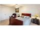 This bedroom features carpet flooring, a ceiling fan, and a wood frame bed at 2801 N Dakota St, Chandler, AZ 85225