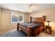 This bedroom features carpet flooring, a ceiling fan, and a wood frame bed at 2801 N Dakota St, Chandler, AZ 85225