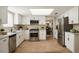 Bright kitchen features white cabinets, stainless steel appliances, and light wood floors at 2801 N Dakota St, Chandler, AZ 85225
