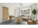 Cozy living room filled with wicker furniture, light-colored decor and neutral tones at 2801 N Dakota St, Chandler, AZ 85225