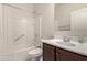 Bright bathroom featuring a shower-tub combo with grab bar and a single sink vanity at 29065 N Fire Agate Rd, San Tan Valley, AZ 85143