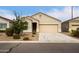 Attractive single-story home with a neutral stucco exterior, a two-car garage, and a well-maintained front yard at 29065 N Fire Agate Rd, San Tan Valley, AZ 85143