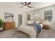 Cozy main bedroom with a ceiling fan, carpeted floors, neutral tones, and a comfortable queen bed at 29065 N Fire Agate Rd, San Tan Valley, AZ 85143