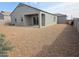 Expansive backyard featuring low-maintenance gravel landscaping, offering a simple outdoor space at 2994 N 305Th Dr, Buckeye, AZ 85396