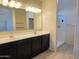 The bathroom features double sinks, a full vanity, and a walk in shower at 2994 N 305Th Dr, Buckeye, AZ 85396