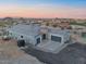 Stunning aerial view of the home shows it's excellent curb appeal, landscaping, and mountain views at 3002 W Josiah Trl, Queen Creek, AZ 85144