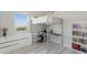 Bedroom featuring a loft bed with desk, dresser, and a large window at 3002 W Josiah Trl, Queen Creek, AZ 85144