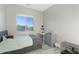 Bedroom with a large window, gray accents, and light, gray wood-look flooring at 3002 W Josiah Trl, Queen Creek, AZ 85144