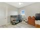 Bedroom featuring metal bunk beds, gray walls, and a bright window with mountain views at 3002 W Josiah Trl, Queen Creek, AZ 85144