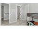 Bedroom featuring a bunk bed and gray walls, with view into the bathroom at 3002 W Josiah Trl, Queen Creek, AZ 85144