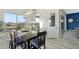 Inviting dining area filled with natural light, featuring a large table with seating and views of the outdoors at 3002 W Josiah Trl, Queen Creek, AZ 85144