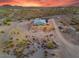 High angle showing house and desert landscape, with brush, trees, and dirt roads at 3002 W Josiah Trl, Queen Creek, AZ 85144