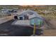 Aerial shot showcasing home with desert landscaping and a large, paved driveway area at 3002 W Josiah Trl, Queen Creek, AZ 85144