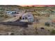 Aerial view shows desert home with large lot, metal fencing, and a few cacti at 3002 W Josiah Trl, Queen Creek, AZ 85144