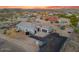 Expansive aerial view of home on large lot with a metal fenced in yard and desert landscaping at 3002 W Josiah Trl, Queen Creek, AZ 85144