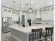 Bright, modern kitchen with a large island and stainless-steel appliances at 3002 W Josiah Trl, Queen Creek, AZ 85144