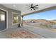 Relaxing covered patio features a ceiling fan, heater, and scenic views of the desert landscape at 3002 W Josiah Trl, Queen Creek, AZ 85144