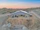 Back view of gray home, showcasing a covered patio perfect for enjoying the desert views at 3002 W Josiah Trl, Queen Creek, AZ 85144