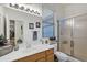 Bathroom featuring a single sink vanity, framed mirror, and a walk-in shower at 3017 S Mesita --, Mesa, AZ 85212