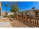 View of the backyard with desert landscaping and a wooden fence at 3104 E Broadway Rd # 276, Mesa, AZ 85204