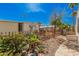 Fenced backyard featuring desert landscaping, a patio area, and mature trees at 3104 E Broadway Rd # 276, Mesa, AZ 85204