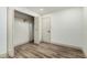 Bedroom featuring modern flooring, an open closet with a rod, and interior doors at 3104 E Broadway Rd # 276, Mesa, AZ 85204