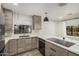 Modern kitchen with stainless steel appliances, quartz counters, and wood cabinets at 3104 E Broadway Rd # 276, Mesa, AZ 85204