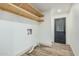 Functional laundry area with open shelving and a practical layout for efficient chores at 3104 E Broadway Rd # 276, Mesa, AZ 85204