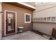 Back patio featuring covered back door, exterior walls, and a small table at 3334 W Morrow Dr # 3, Phoenix, AZ 85027