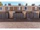 Exterior view of home featuring townhouse facade, fencing, and gravel landscaping at 3334 W Morrow Dr # 3, Phoenix, AZ 85027