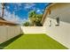 Artificial grass provides low maintenance in this compact and private backyard at 4381 N 86Th St, Scottsdale, AZ 85251