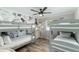 Charming bedroom featuring gray bunk beds, floral wallpaper, and a ceiling fan at 4381 N 86Th St, Scottsdale, AZ 85251