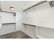 Spacious closet with wood floor and ample shelving and hanging storage at 4381 N 86Th St, Scottsdale, AZ 85251