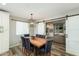 Dining area with barn door and modern lighting at 4381 N 86Th St, Scottsdale, AZ 85251