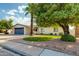 Inviting home with a mature shade tree, a two-car garage, and a manicured artificial lawn at 4381 N 86Th St, Scottsdale, AZ 85251