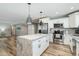 Bright, modern kitchen with stainless steel appliances and a marble-topped center island at 4381 N 86Th St, Scottsdale, AZ 85251